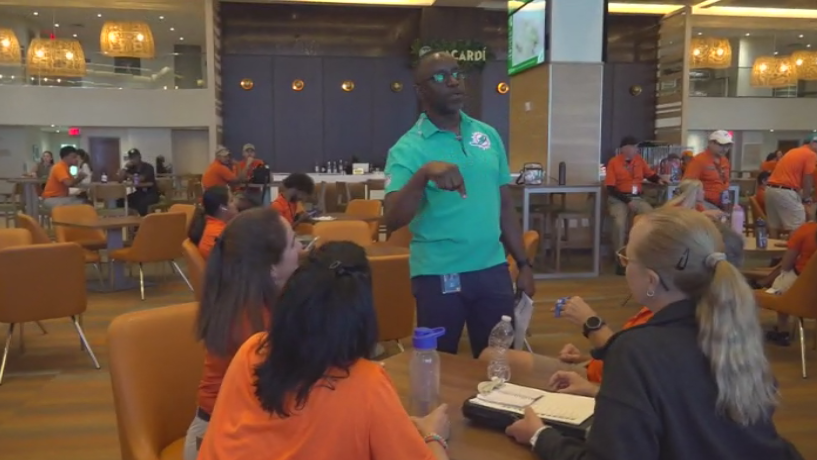 Miami Dade College professor finds his passion with side job at Hard Rock Stadium — CBS Miami, Midland Arts news